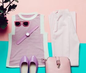 Clothes and accessories. Top view. Top, shoes, watches and sunglasses. Stylish bag. Summer Pink trend
